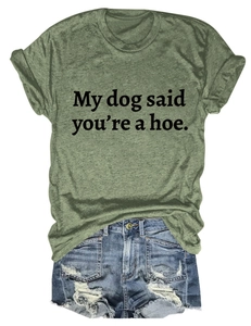 Close-up of army green t-shirt with My dog said you're a hoe text and denim shorts