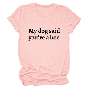 Close-up of 'My dog said you're a hoe' black slogan print on pink cotton t-shirt