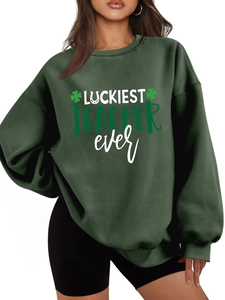 Detail of dark green oversized teacher sweatshirt with Luckiest Teacher Ever print