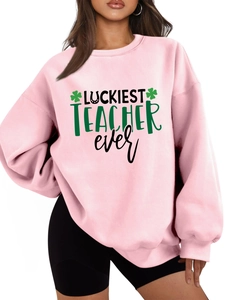 Detailed close-up of pink fleece sweatshirt with Luckiest Teacher Ever embroidery