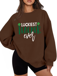 Detail of St. Patrick's Day teacher sweatshirt showing clover print and soft fabric texture