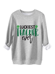 Detail of gray sweatshirt with Luckiest Teacher Ever print and green clover graphics