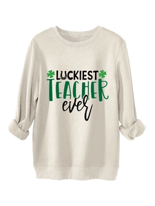 Detail of Luckiest Teacher Ever sweatshirt featuring green shamrock and horseshoe print