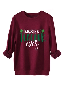 Close-up of wine red sweatshirt fleece lining and Luckiest Teacher Ever clover print