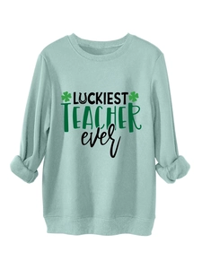 Detail of St. Patrick's Day mint sweatshirt with Luckiest Teacher Ever text and shamrock