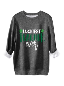 Detail of dark grey fleece sweatshirt featuring green Luckiest Teacher Ever print
