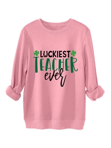 Detail of pink fleece sweatshirt with Luckiest Teacher Ever text and clover design