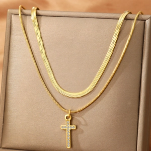 Double-layered gold-plated cross pendant necklace set with shimmering rhinestones