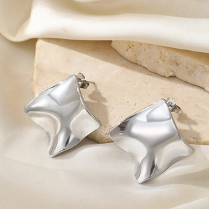 Minimalist silver wavy geometric earrings with mirror finish on stone and silk background