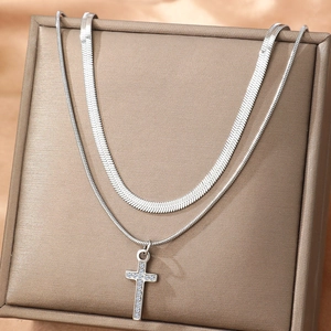 Double-layered silver necklace with rhinestone cross pendant and flat snake chain