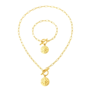 Gold paperclip chain jewelry set with toggle clasp and compass pendant charms