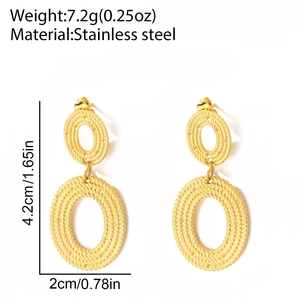 Macro view of woven textured gold stainless steel oval earrings with 4.2cm size specs