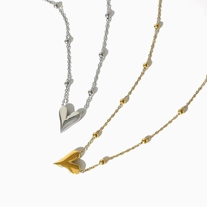 Minimalist gold and silver puffy heart necklaces with bead accented chains for women