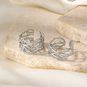 Modern thorny branch silver titanium ring with hollow layered lines on natural stone