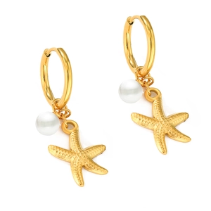 Gold hoop earrings with sea star charms and white pearls on white background