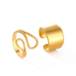 Set of two gold ear cuffs featuring smooth wide band and twisted wave textures