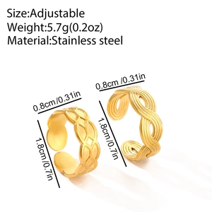 Detail of adjustable stainless steel rings featuring mesh and wave textures in gold finish