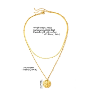 Detail of double-layer stainless steel necklace with hammered round pendant and bead chain