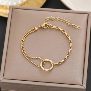 Minimalist gold-plated stainless steel chain bracelet with a ring pendant and bead links
