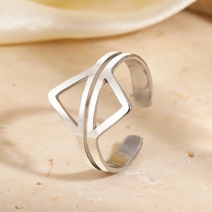 Minimalist silver geometric open ring with asymmetric cutout design on stone surface