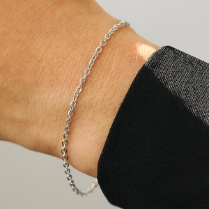 Minimalist silver stainless steel link bracelet for women worn on wrist for layered styling