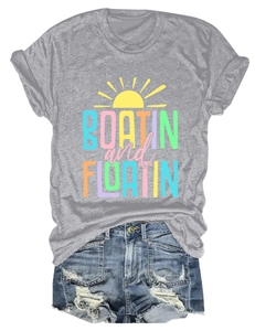 Detail of grey Boatin and Floatin t-shirt paired with distressed blue denim shorts