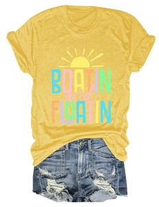 Detail of Boatin and Floatin yellow cotton t-shirt and distressed denim shorts
