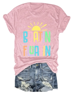 Close-up of Boatin and Floatin text print on pink short sleeve t-shirt with rainbow colors