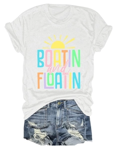 Close-up of white T-shirt with sun graphic and frayed hem denim shorts for summer