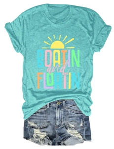 Detail of Boatin and Floatin print on casual blue t-shirt with ripped denim shorts