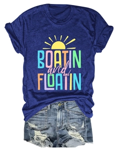 Close-up of Boatin and Floatin royal blue T-shirt with distressed denim shorts