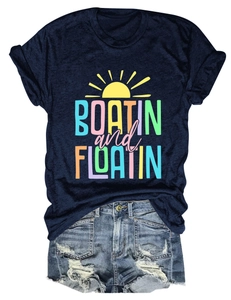 Flat lay of navy Boatin and Floatin cotton T-shirt with distressed denim shorts