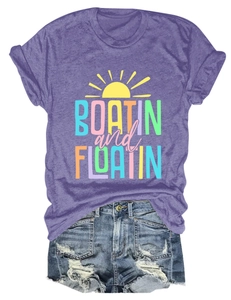 Flat lay of purple cotton t-shirt with Boatin and Floatin sun print and denim shorts