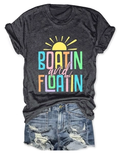 Flat lay of gray Boatin and Floatin short sleeve tee and distressed denim shorts outfit