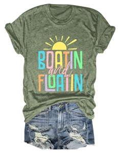 Detailed flat lay of green Boatin and Floatin cotton tee with distressed denim shorts