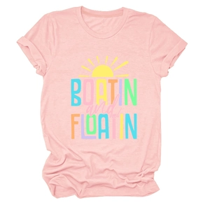 Detailed view of pink cotton T-shirt featuring BOATIN' and FLOATIN' graphic sun print