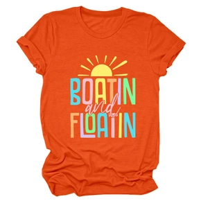 Detail of soft orange cotton T-shirt featuring vibrant sun and outdoor themed print