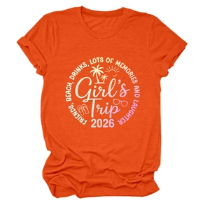 Dettaglio t-shirt in cotone arancione con vivace design grafico Girl's Trip 2026