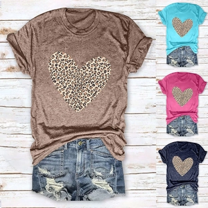 Flat lay of women's leopard heart t-shirt sets in four colors with ripped denim shorts