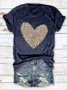Flat lay of gray T-shirt with leopard heart print and distressed denim shorts