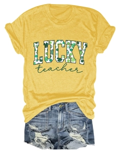Detail of yellow cotton t-shirt with lucky teacher print and ripped denim shorts