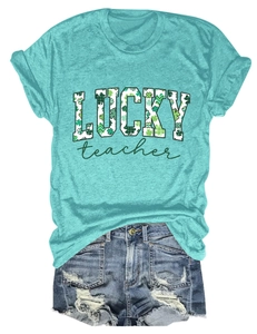 Detail of teal crewneck t-shirt with Lucky Teacher shamrock print and denim shorts