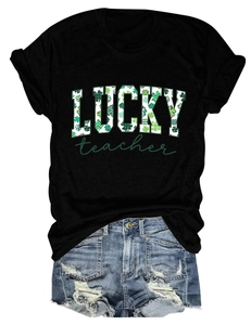 Close-up of black Lucky Teacher St. Patrick's Day t-shirt and ripped denim shorts set