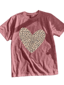 Detail of leopard print heart design on a dusty pink short sleeve t-shirt fabric