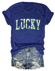 Detail of St. Patrick's Day Lucky Teacher print on navy cotton t-shirt with denim shorts