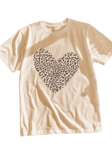 Close-up of leopard print heart graphic on beige short sleeve crew neck cotton T-shirt