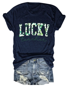 Close-up of Lucky Teacher clover print on dark blue cotton T-shirt with denim shorts
