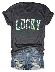 Close-up of St. Patrick's Day Lucky Teacher dark grey t-shirt with green clover pattern