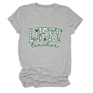 Close-up of Lucky Teacher text with green clover texture on gray St. Patrick's Day T-shirt