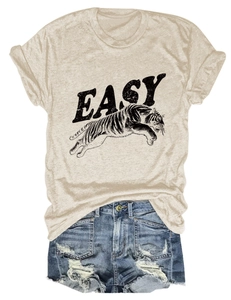 Close-up of beige T-shirt with tiger print and denim shorts for casual summer style